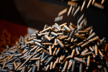 Shell casings fall down in ammunition production workshop