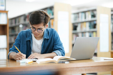 Student studying at library.