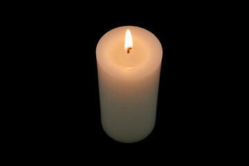 Top view of white burning candle isolated on black background.	