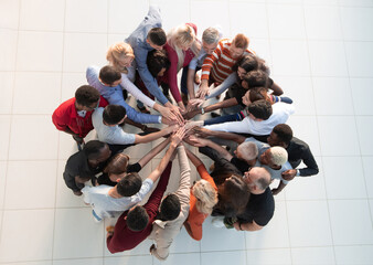 Group of people with hands together - teamwork concepts