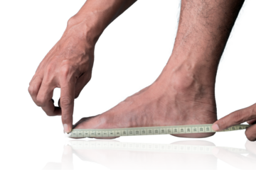 Close-up of a man measuring foot size with a measuring tape on a clipping path white background
