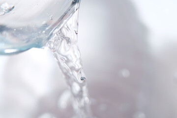 Pouring mineral water into container