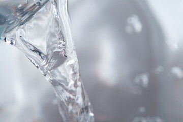 Pouring mineral water into container