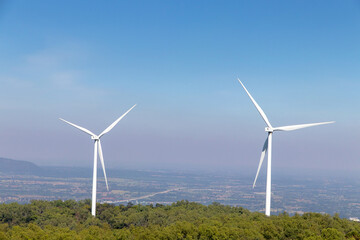 Wind turbines farm on mountanis landscape at Lam Takong Reservoir Views against blue sky with clouds background,Windmills for electric power ecology concept