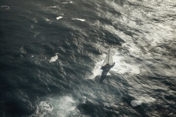 Obraz premium sailboat navigating on the vast blue ocean seen from above. Generative AI