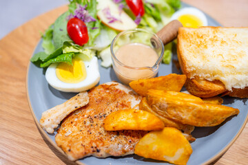 All day breakfast with grill chicken fillet and salad