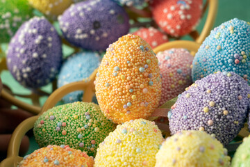 Fototapeta na wymiar Decorative Easter eggs of different colors close-up