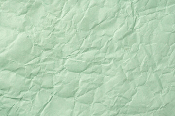 Recycled crumpled turquoise paper texture or paper background for design with copy space for text or image