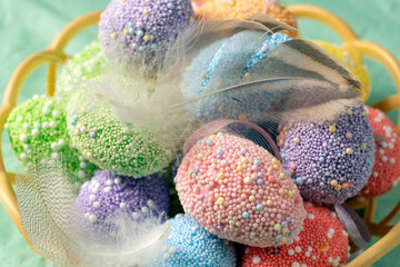 Decorative Easter eggs of different colors close-up