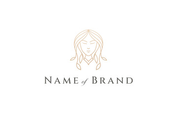 woman face logo with hair decorated with leaves in gold line art design style