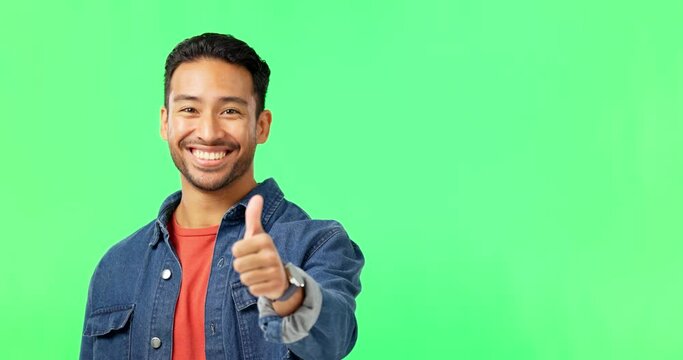 Face, thumbs up and man in green screen studio with yes, thank you and winning hand sign on mockup background. Hand, portrait and man with gesture for support, success and good job emoji isolated