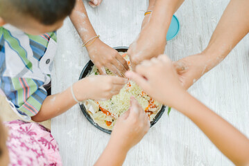 Many hands picking up pizza, made with whole grain flour and vegetables, organic lifestyle and vegan concept.