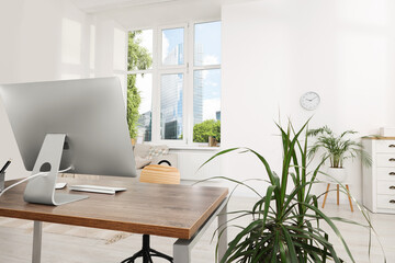 Comfortable workplace in stylish room. Home office