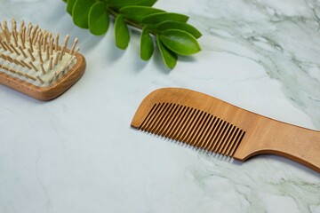 Close-up. wooden combs, hair combs and personal care on background. hair treatment concept.
