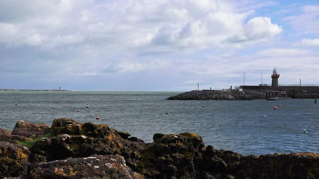 Dunmore East Fishing Harbour Waterford the entrance to the harbour with Hook Head lighthouse in the distance across the Estuary
