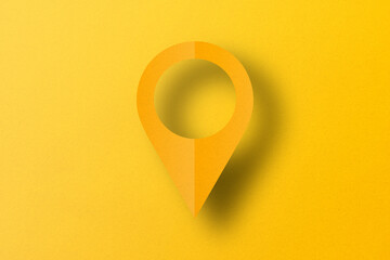 Yellow paper cut into shapes, placement pins. pointer pad location mark set on yellow paper background