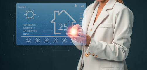 A woman is using an application on her smartphone to control various devices in the house. Smart home.