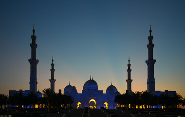 Dusk view to Sheikh Zayed Grand Mosque in Abu Dhabi. Silhouette of Grand Mosque landmark in United Arab Emirates.