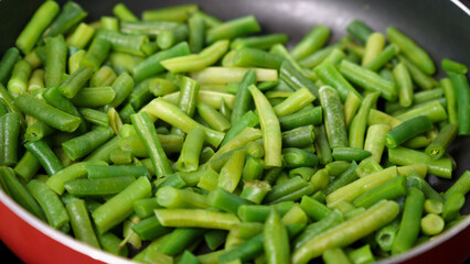 Green beans ready for cooking in frying pan. Bio green beans. Cooking concept