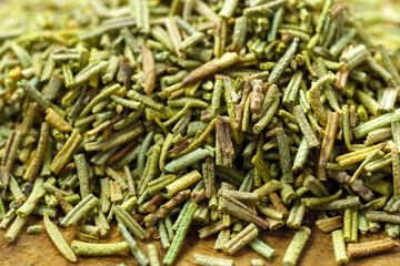 Rosemary spice close up. Pour a spoon of dry seasoning. Spices and herbs for cooking. Selective focus