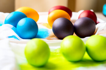 Painted eggs on the table after painting, a symbol of Easter, eggs