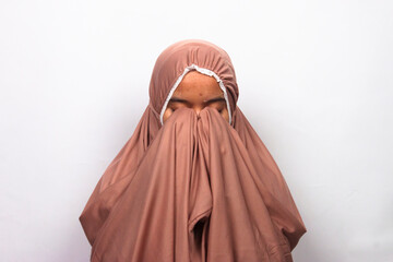 Islamic moslem woman praying wearing traditional dress