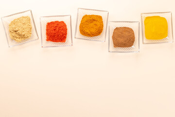Various dried spices in small bowls