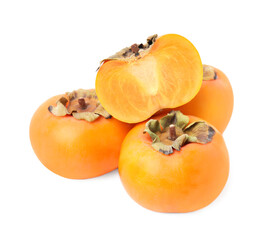 Whole and cut delicious ripe juicy persimmons on white background