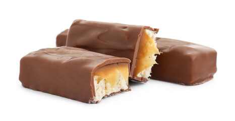 Pieces of chocolate bars with caramel on white background