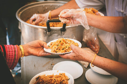 A free food kitchen that feeds hundreds of hungry poor people : problem concepts of disadvantaged people and hunger.