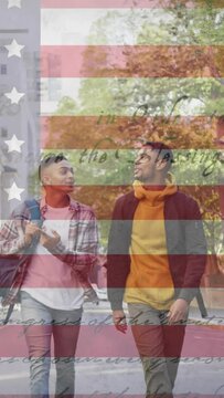 Animation of american flag and constitution text over biracial male couple walking in city