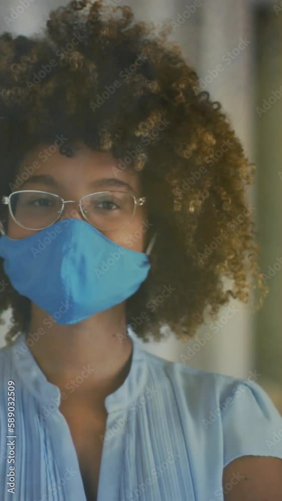 Sticker Animation of light spots over african american woman with face mask