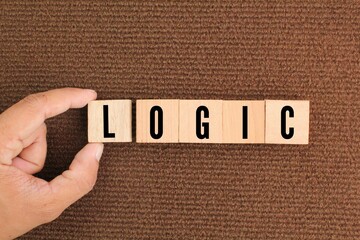 wooden cube with logic words. logical concepts or think correctly. mind test concept. 