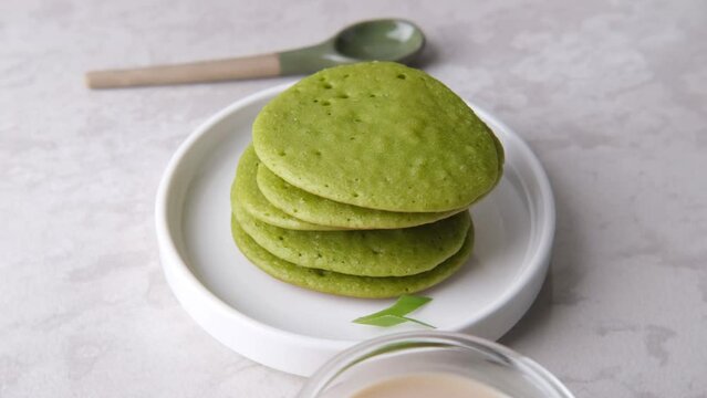 Serabi or Surabi,  Indonesian pancake made of flour, rice flour and coconut milk. Served with palm sugar sauce. Sweet and savory. 
