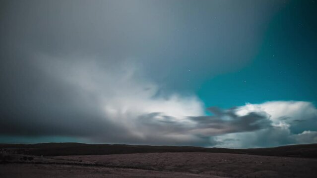 Time lapse of the moonlit, winter night sky with the clouds passing by. Filmed on the Isle of Lewis, part of the Outer Hebrides of Scotland.