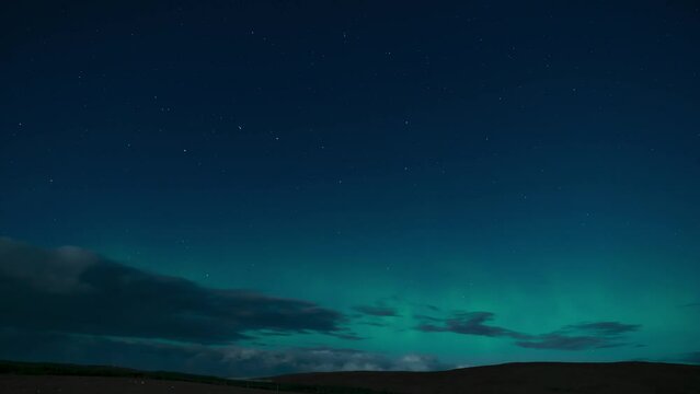 Time lapse of the aurora borealis (the northern lights) on a moonlit night with clouds passing by. Filmed in the village of Back on the Isle of Lewis, part of the Outer Hebrides of Scotland.
