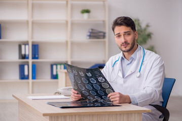 Young male doctor radiologist working in the clinic