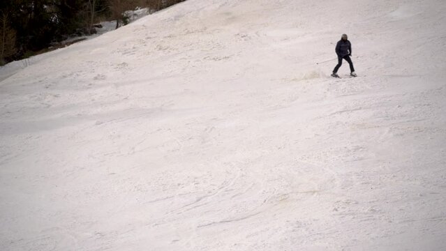 Single Skier Going Down The Slope Covered With A Thick Layer Of White Snow, Sinaia, Romania