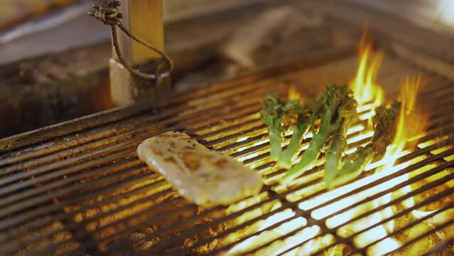 Pork and Broccolini on Charcoal Fire Grill