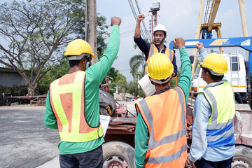 Engineers and workers meeting at construction site construction industry concept.