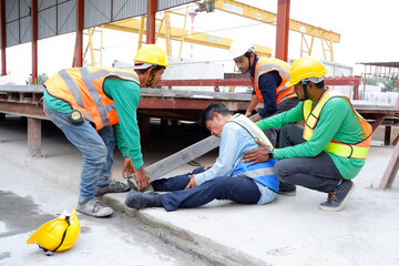 construction worker accident and colleagues to help.