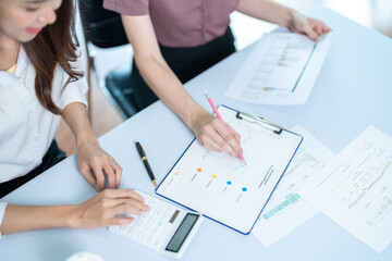 Two female colleagues working together in the office