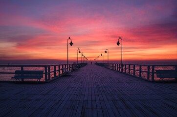 Fototapeta na wymiar Beautiful sunrise over the Polish sea. Popular pier on the Baltic Sea at sunrise. Photo taken in Gdynia, Poland.