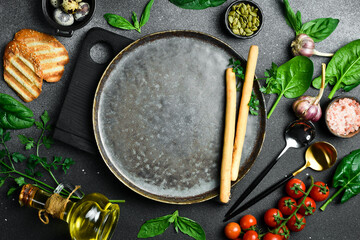 Cooking background. Kitchen table with spices and vegetables. Healthy food concept. Advertising photo.