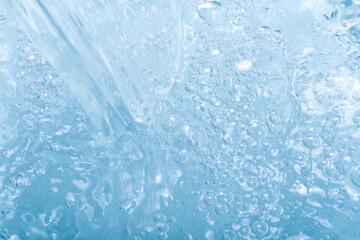 pour blue clear water with bubbles background.