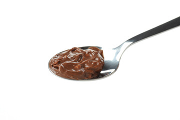Spoon with chocolate paste isolated on white background