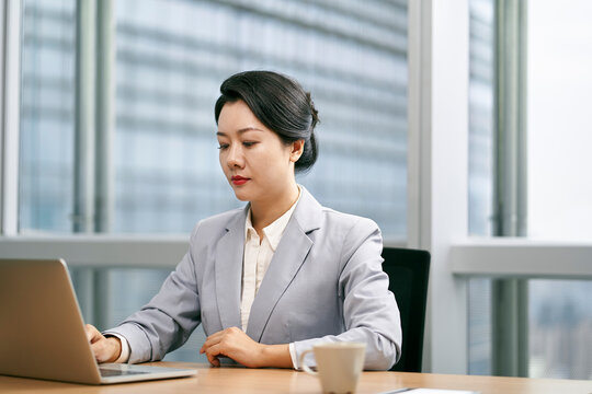 young asian businesswoman working in modern office