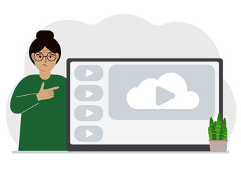 A woman near a large screen TV, tablet or computer with a video play button. The concept of watching a video, channel or live broadcast.