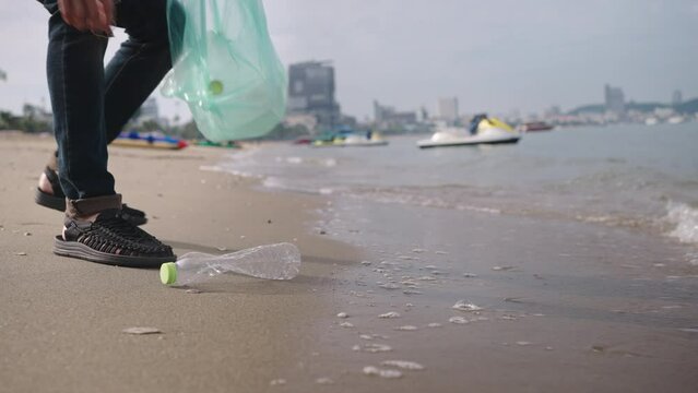 volunteering,charity,microplastic,cleaning,people picking up plastic bottle cleaning on the beach.,agriculture and climate change,microplastic waste.food industry and plastic packaging. 