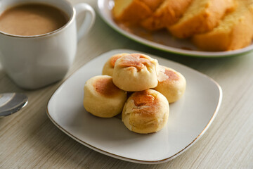 Bakpia cake typical of Yogyakarta with various kinds of fillings served on a plate with tea, coffee and other cakes